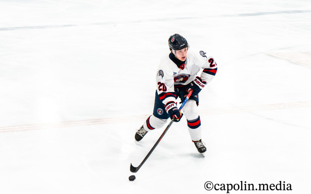 Second-Period Surge Powers Rebels to 5-2 Win